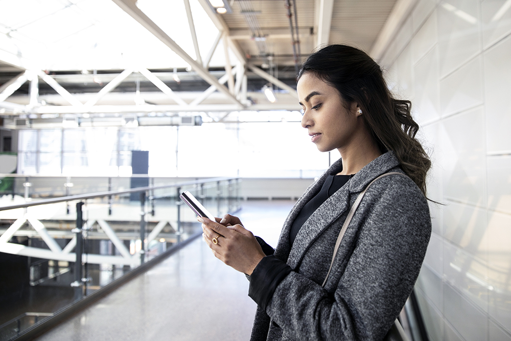 Young businesswoman using smart phone