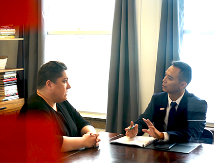 Alter Agents Founder & CEO Rebecca Brooks speaking to a Cathay Bank banker in a business meeting. 