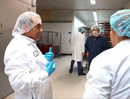 Beef Jerky Factory CEO Waleed Saab speaking with his employees at the company’s factory. 