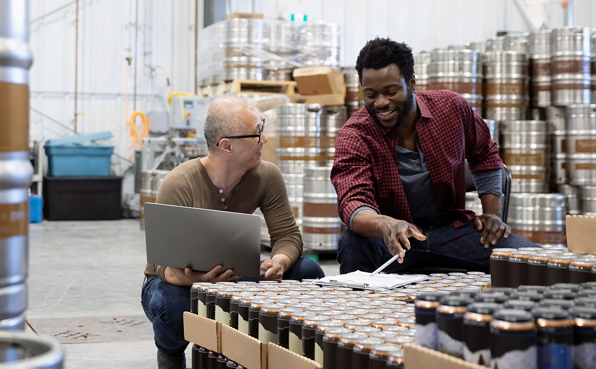 Two staff working in warehouse