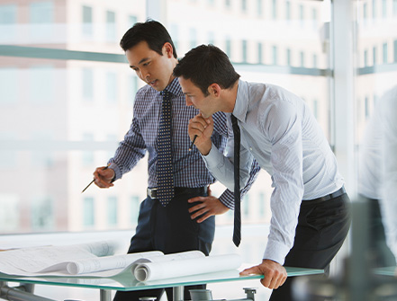 Businessmen working together in office