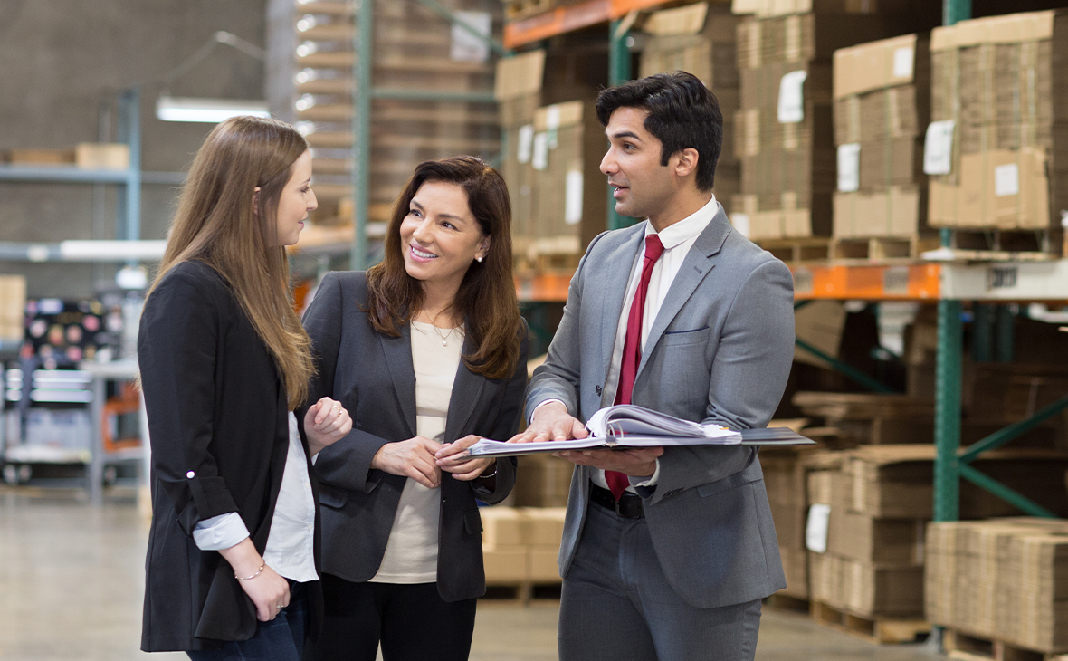 A Cathay Bank officer discussed business lending with two businesswomen. 