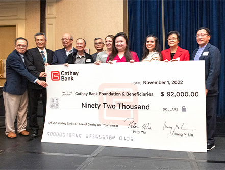 Cathay Bank Executives present a $92,000 check to representatives from local nonprofits who will benefit from the funds raised at the bank’s golf tournament event.