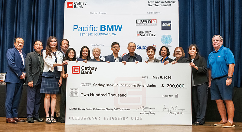 Cathay Bank presents a check to representatives from local nonprofits who will benefit from the funds raised during the 49th Annual Charity Golf Tournament..