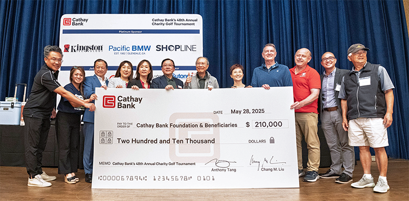 Cathay Bank presents a $210,000 check to representatives from local nonprofits who will benefit from the funds raised at the bank’s golf tournament event.