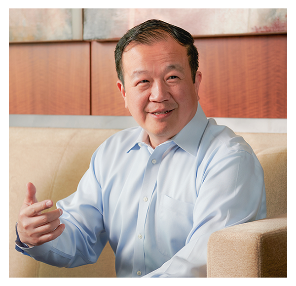 Cathay Bank’s President and CEO, Chang M. Liu, sits down to chat with others during a business meeting.