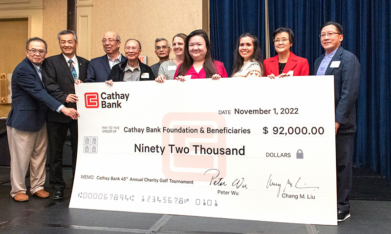 Cathay Bank Executives present a $92,000 check to representatives from local nonprofits who will benefit from the funds raised at the bank’s golf tournament event.