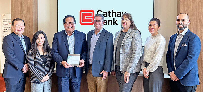 Cathay Bank team members pose with the 2023 Gallagher Award with members from the firm at the Temple City branch in California.