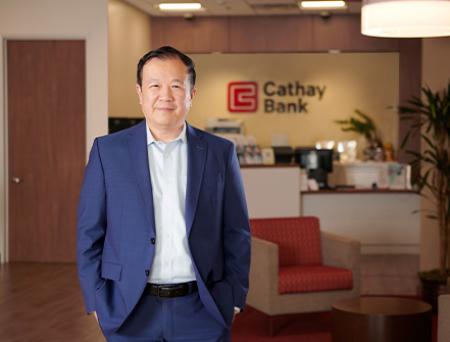 President and CEO of Cathay Bank, Chang M. Liu, stands inside a branch