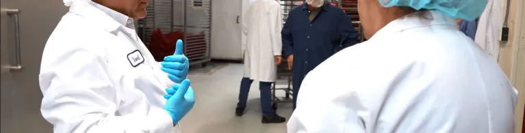 Beef Jerky Factory CEO Waleed Saab speaking with his employees at the company’s factory. 