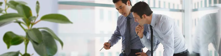 Businessmen working together in office