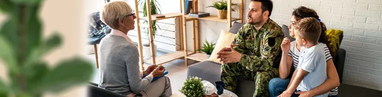 A business consultant meets with a veteran and his family to discuss business opportunities and special programs available to small business owners. 