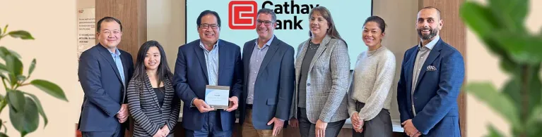 Cathay Bank team members pose with the 2023 Gallagher Award with members from the firm at the Temple City branch in California.