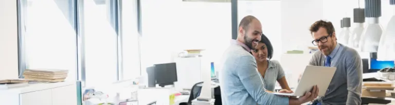 Interior designers using digital tablet in office