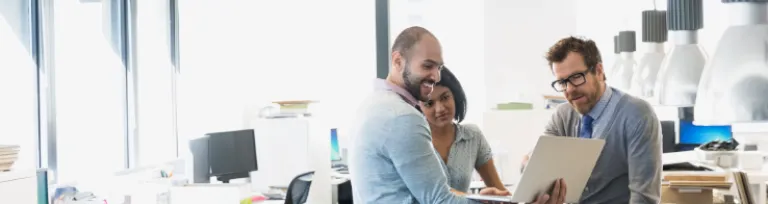 Interior designers using digital tablet in office.