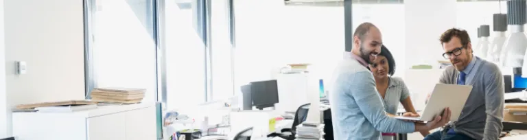 Interior designers using digital tablet in office