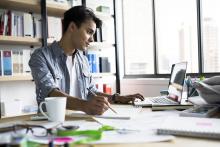 Architect working at laptop in office