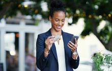 A women is registering her card on her new mobile app