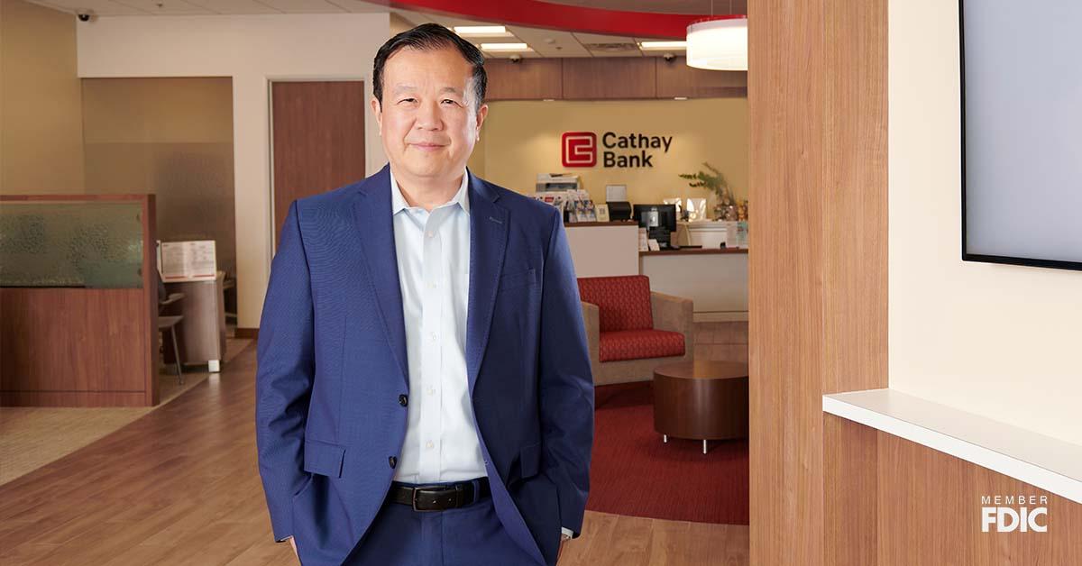 President and CEO of Cathay Bank, Chang M. Liu, stands inside a branch