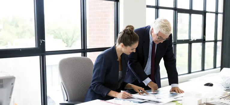 Business people working on laptop in office