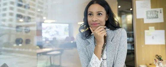 A young architect looking away at desk