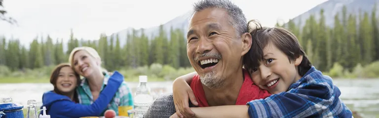 Family relaxing together at campsite