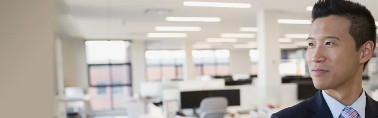 Portrait confident businessman in office.