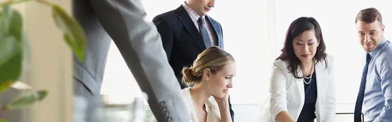 Business colleagues in discussion at conference table